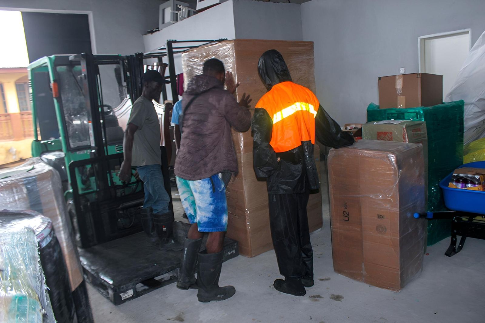 The team moving a large crate into place