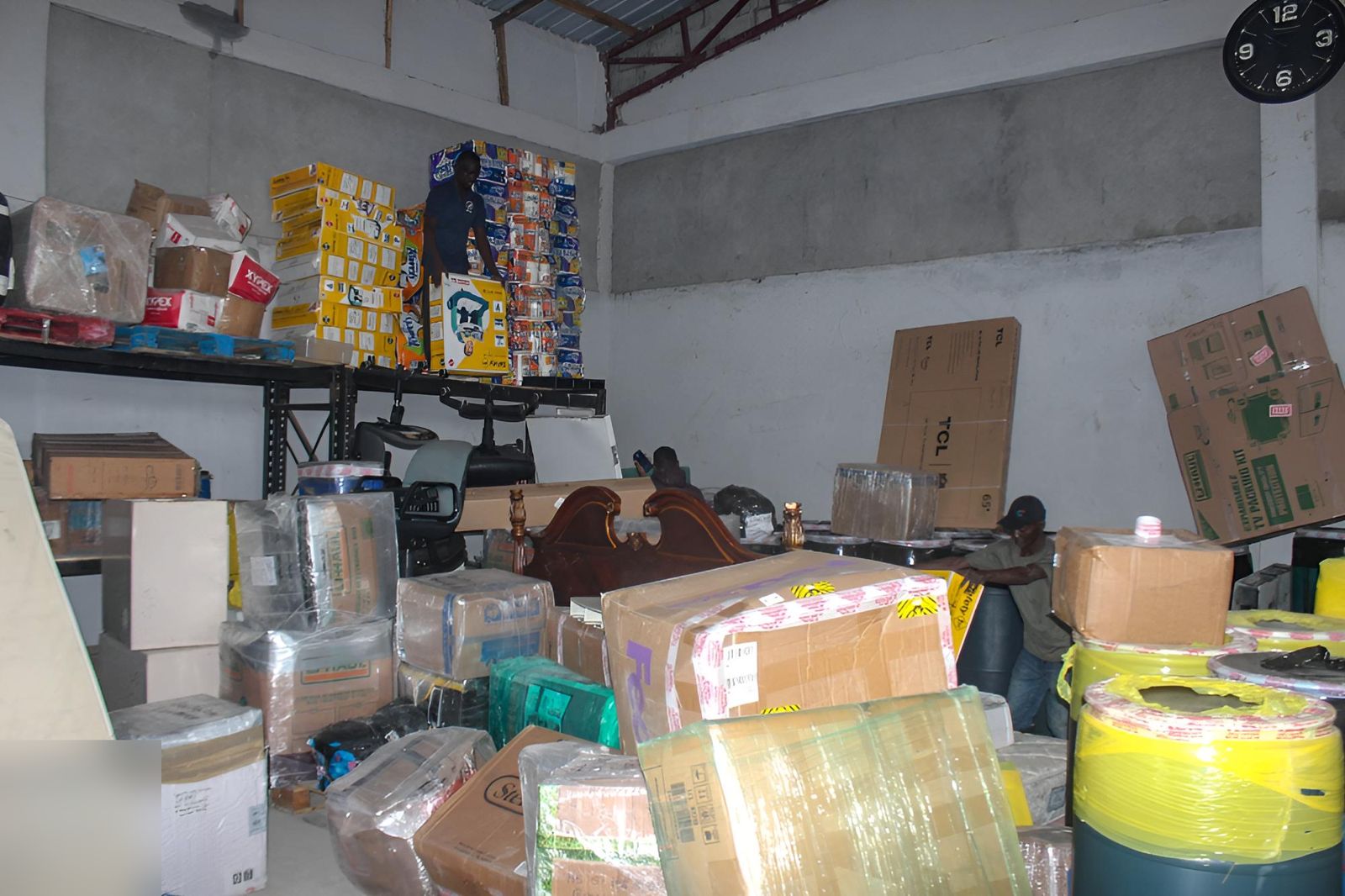 Goods stacked on shelving and the floor