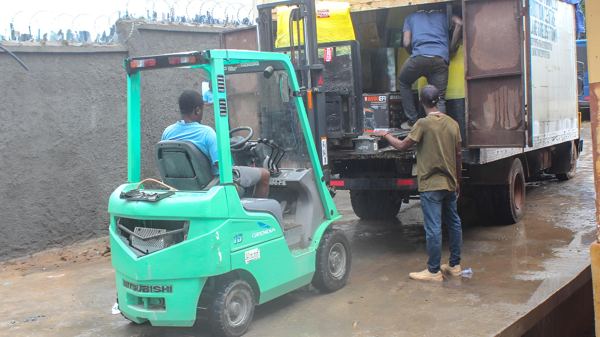Loading the truck for delivery across Freetown