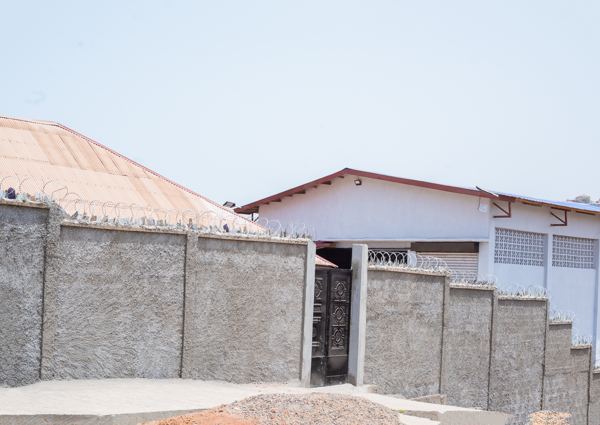 Perimeter wall and pedestrian gate