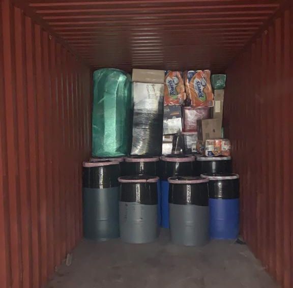 Boxes and barrels packed in a shipping container